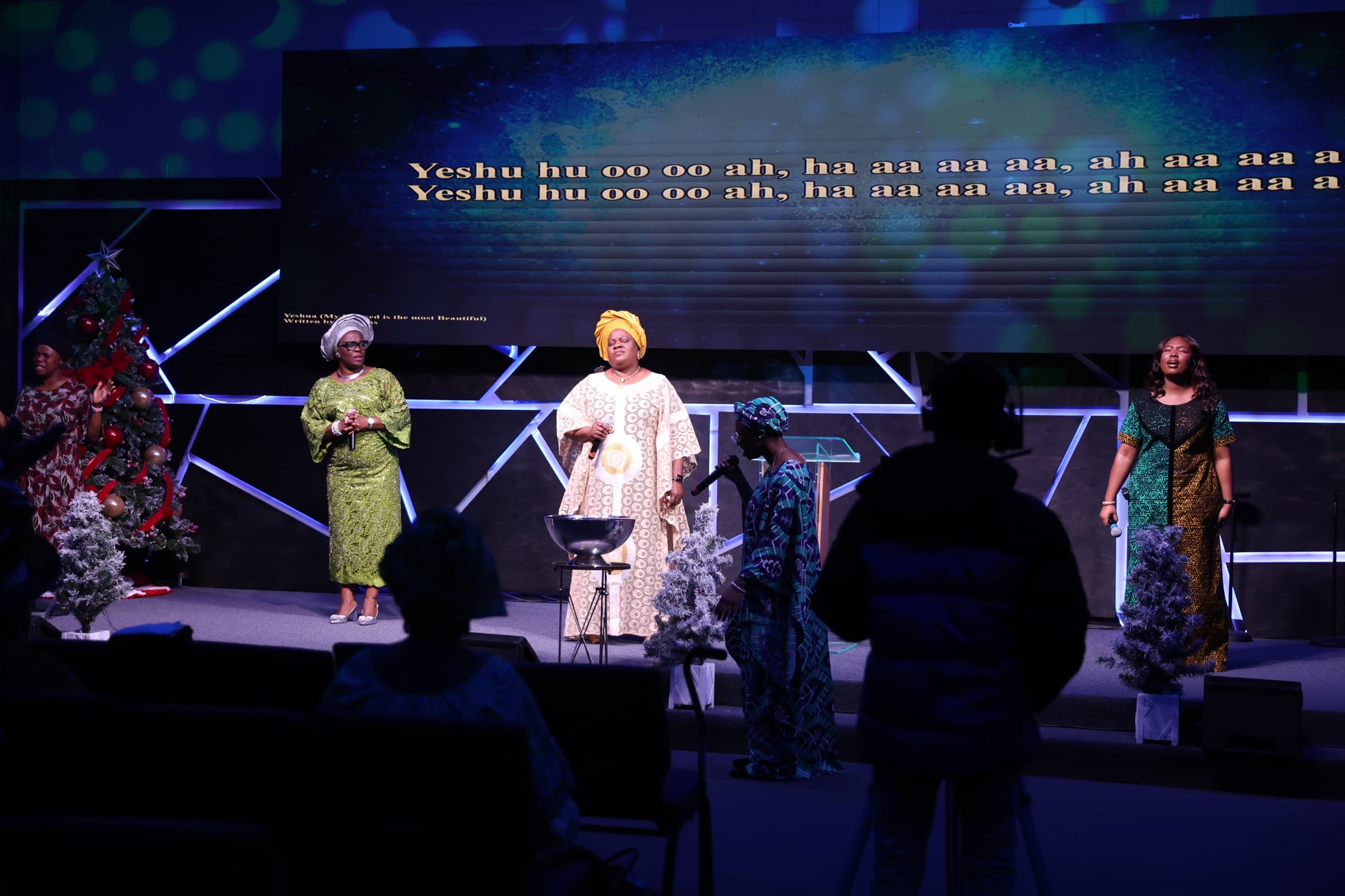 Women of the church leading worship from the stage