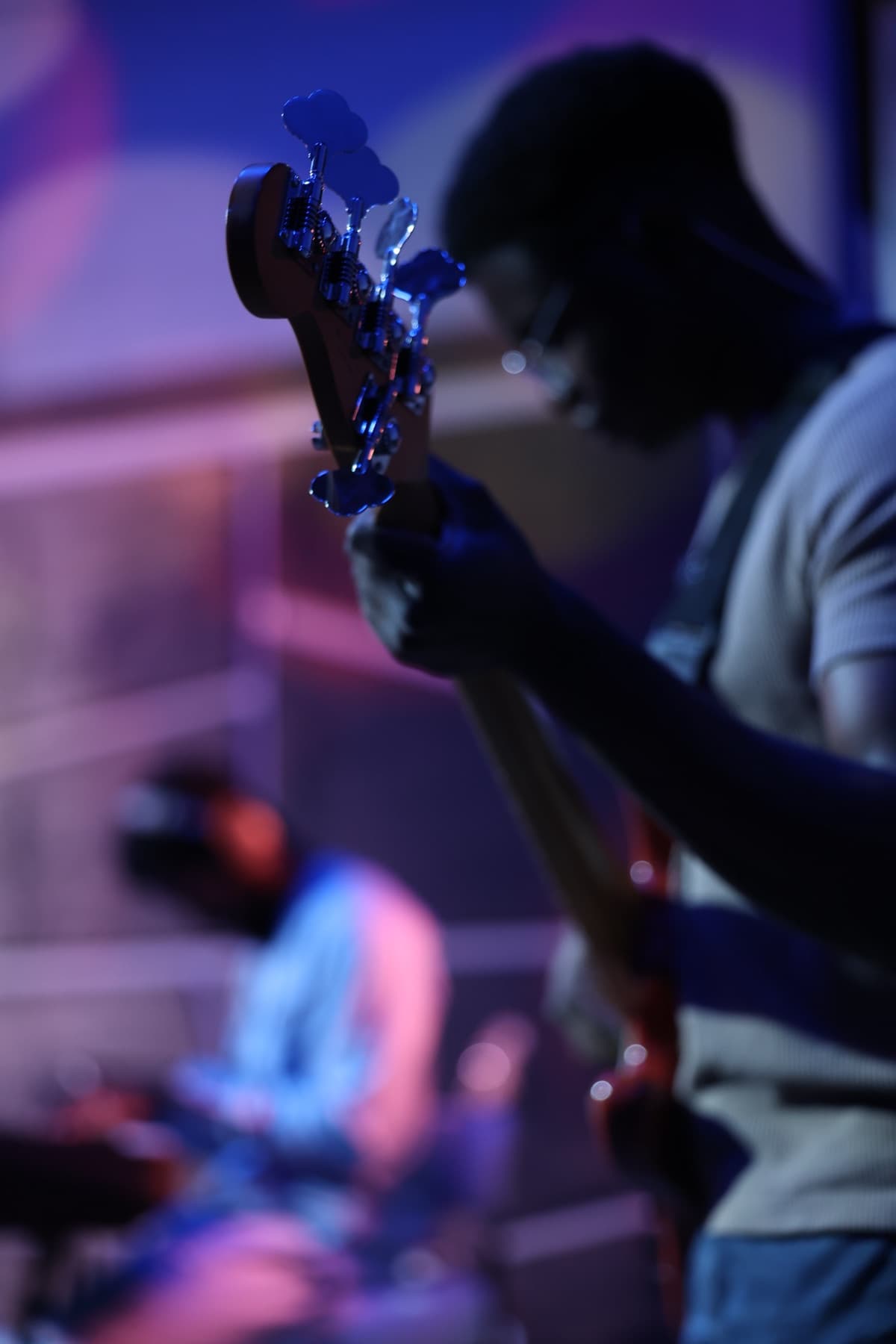 A bassist playing on stage during a worship service
