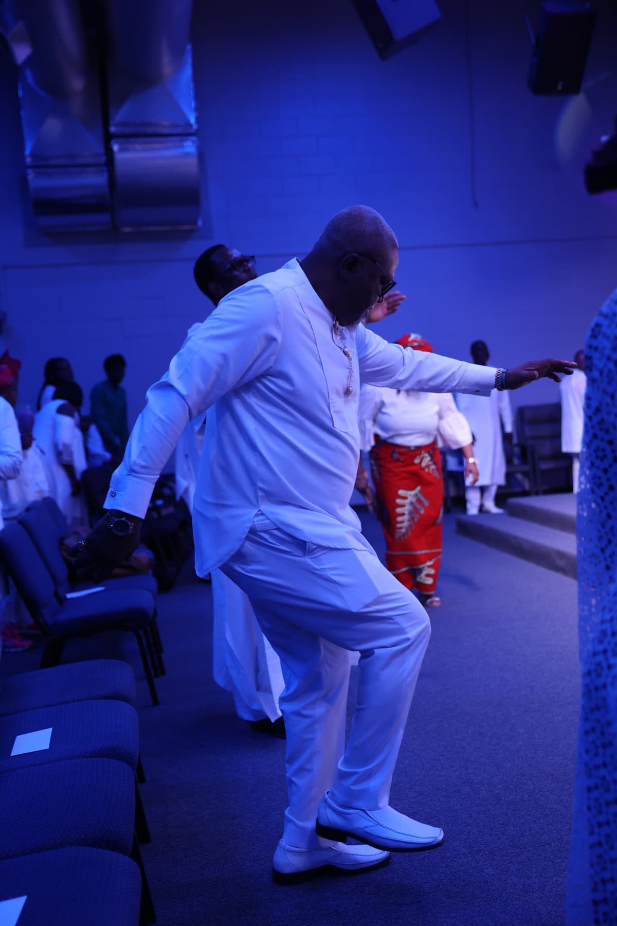 A dancer in motion during a worship service at Amazing Grace Ministries